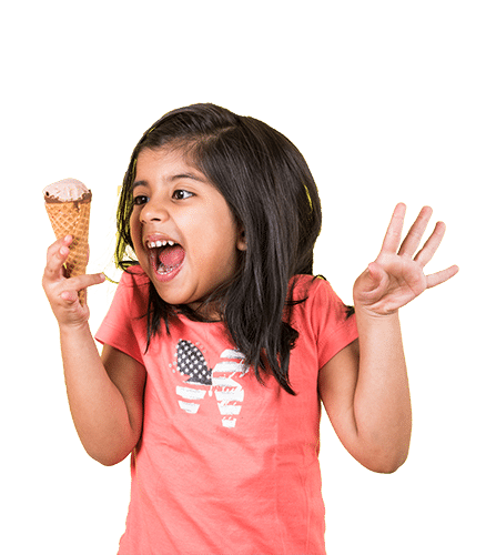 Turn Bad News Into Happiness Img 1 Turn bad news into happiness image shows little girl holding an ice cream cone. She is wearing a melon colored shirt and has a huge smile on her face.