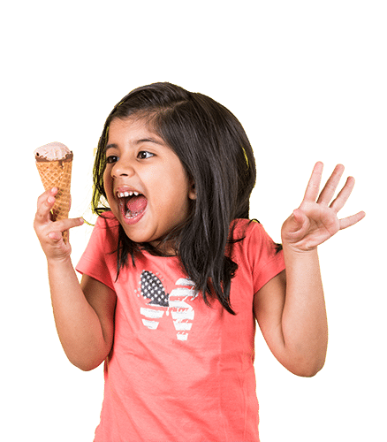 Turn bad news into happiness image shows little girl holding an ice cream cone. She is wearing a melon colored shirt and has a huge smile on her face.